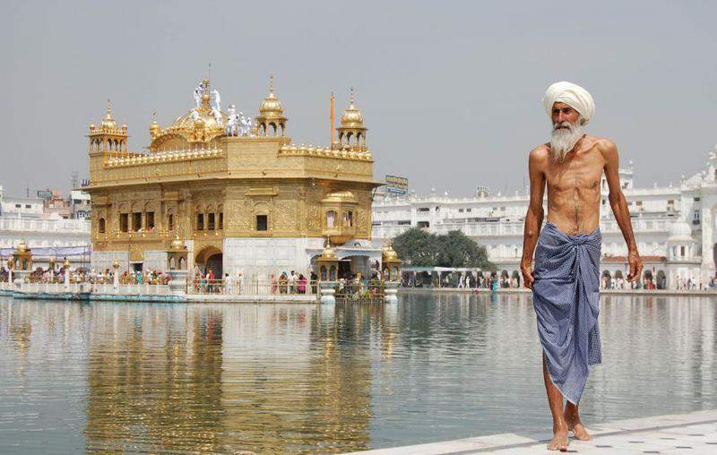 Sikh pilgrim At The Golden Temple (Harmandir Sahib) In Amritsar, India